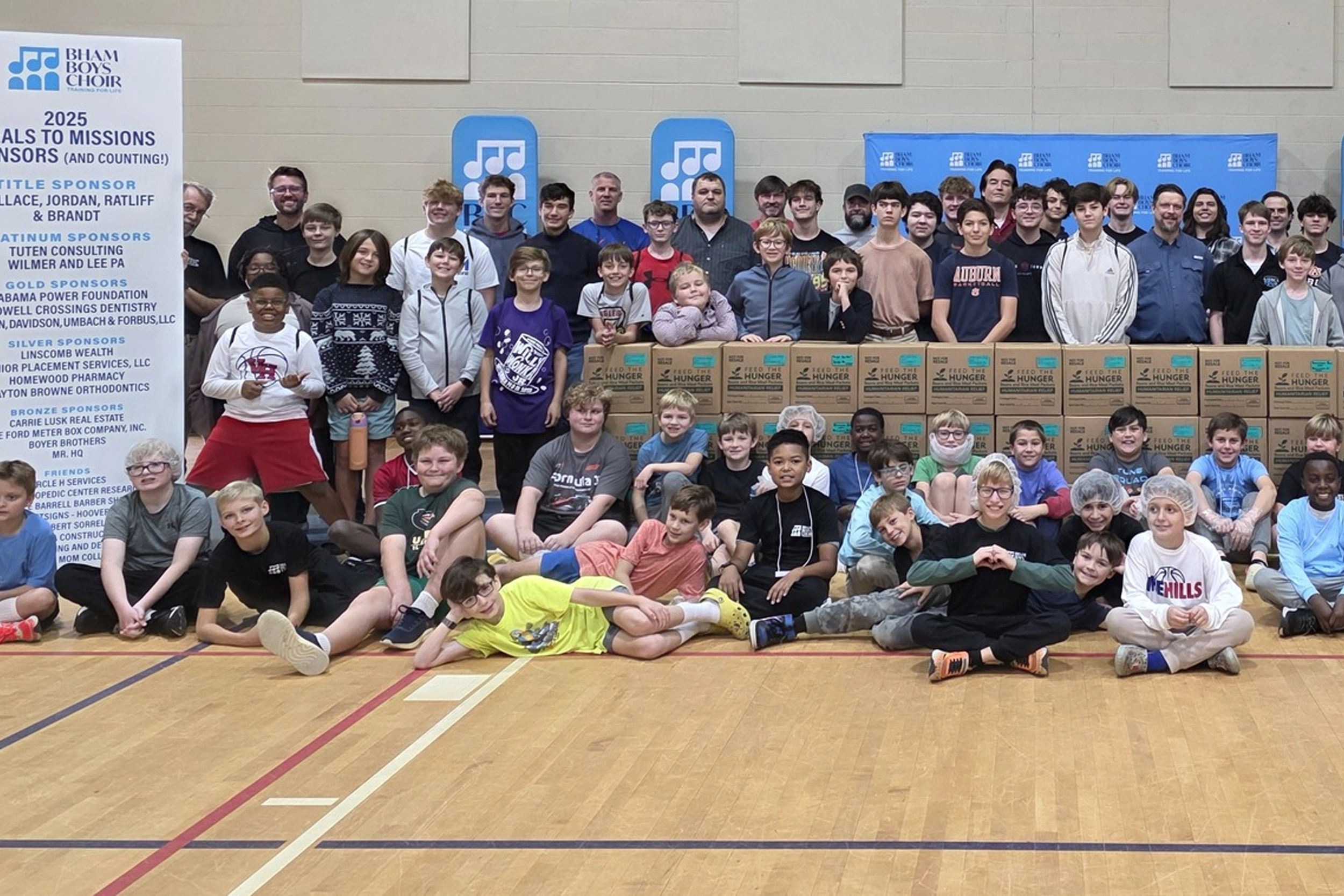 Birmingham Boys Choir volunteers packing meals for Meals to Missions
